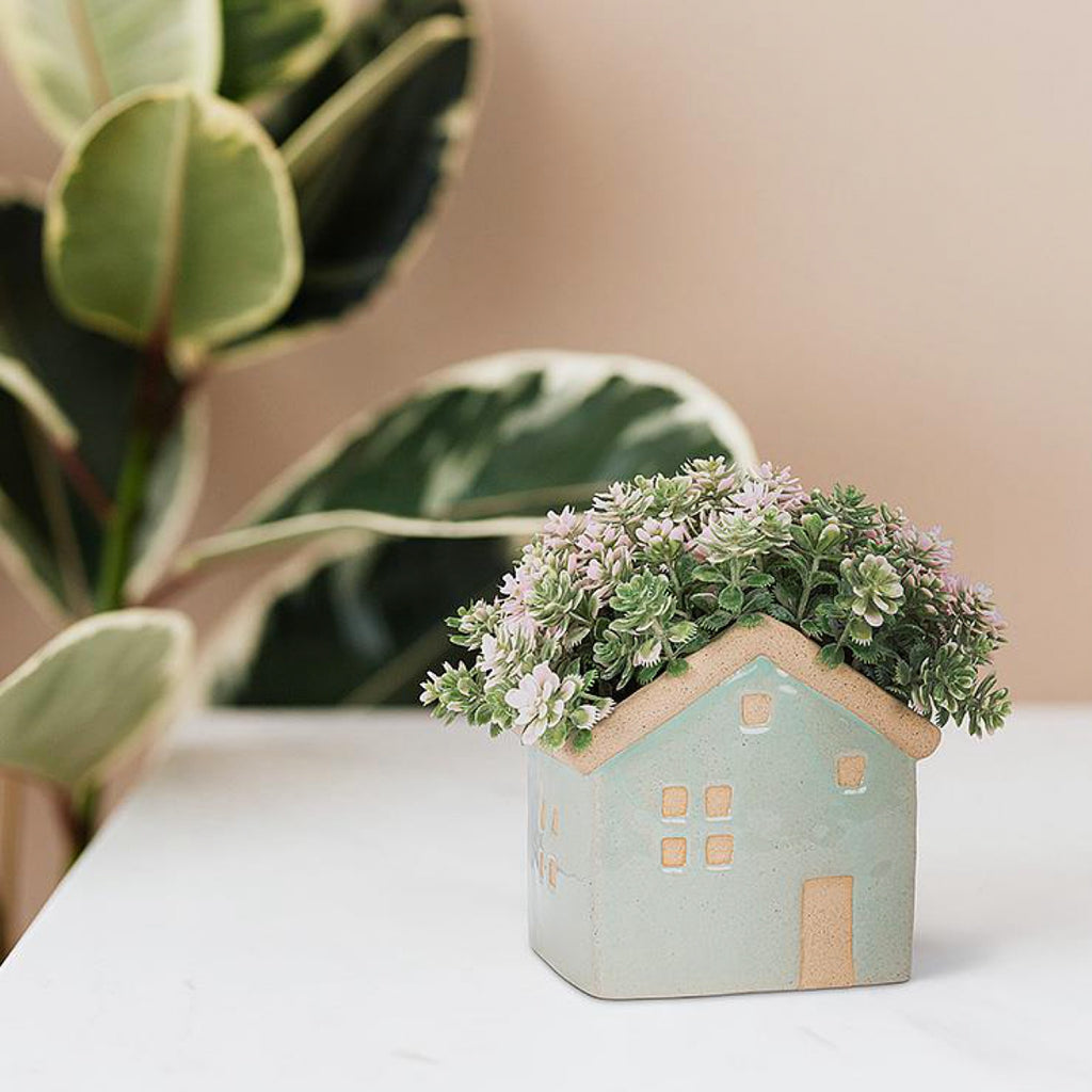 Small House Planter on table.