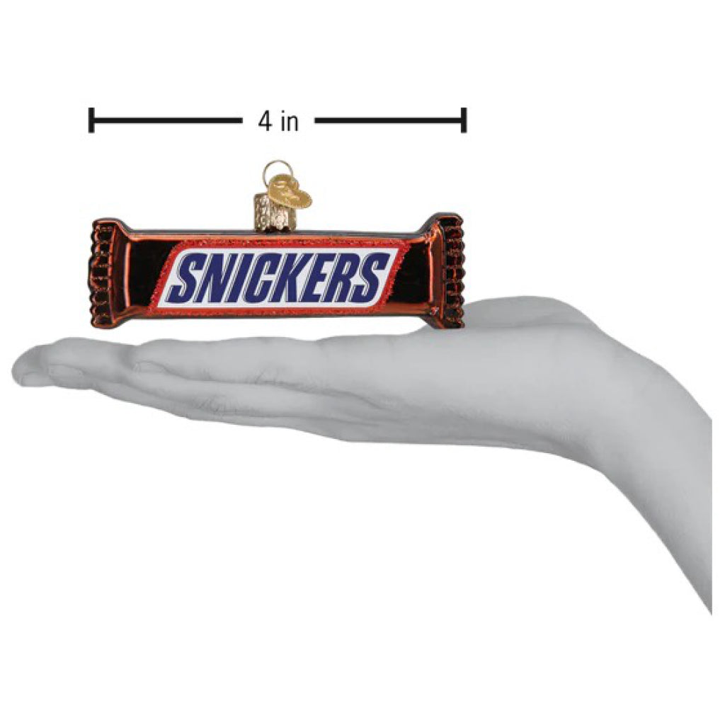 Snickers Ornament being held.