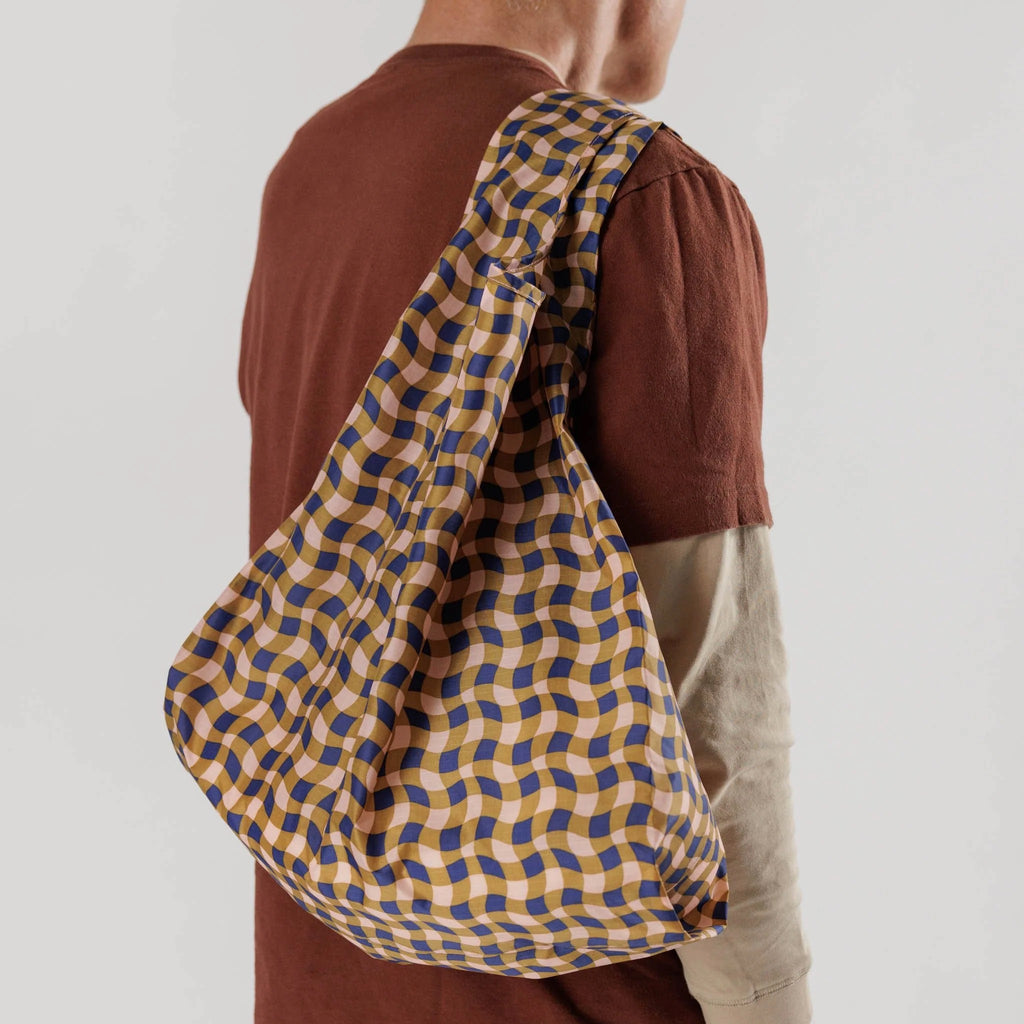 Standard Baggu Wavy Gingham Peach over shoulder.