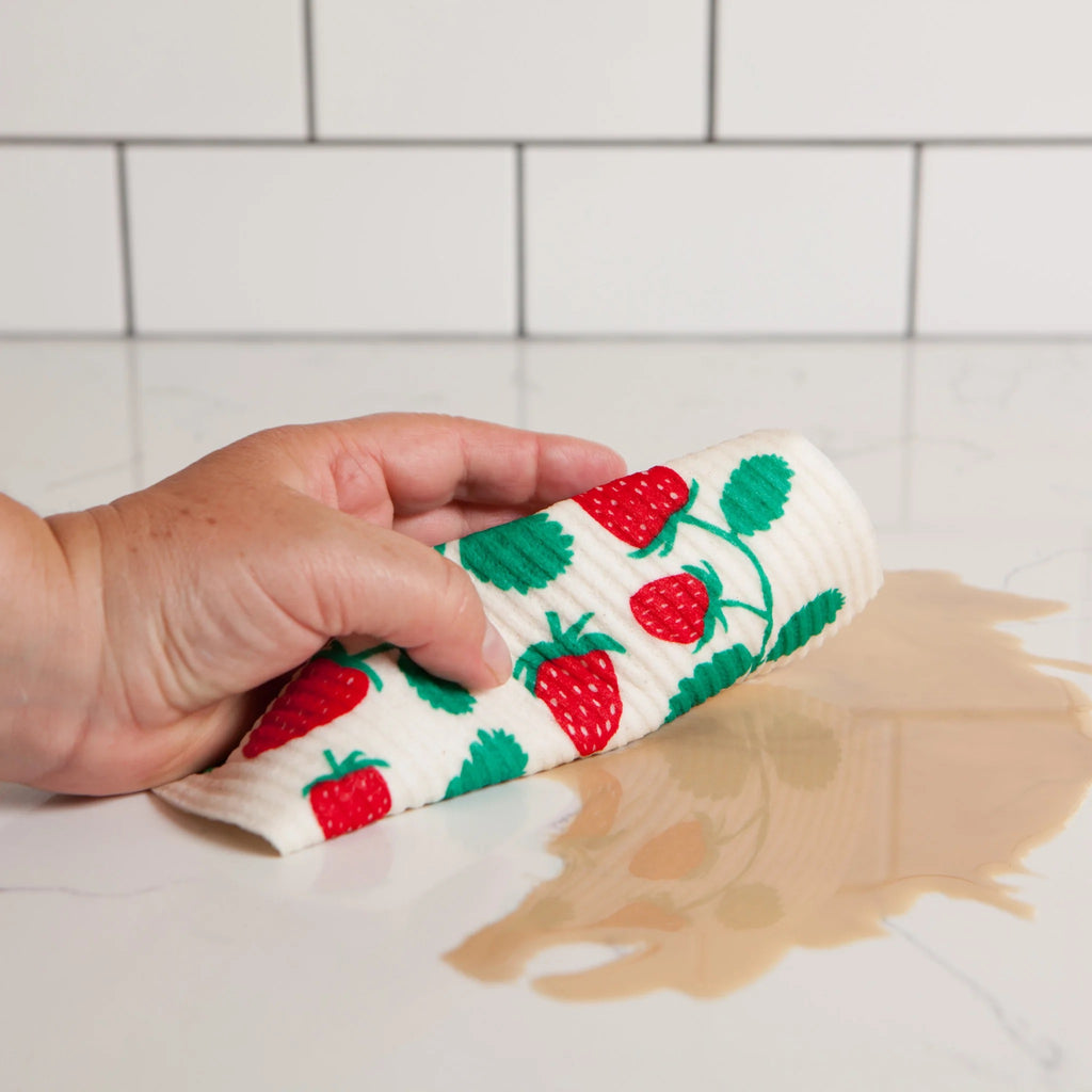 Strawberries Swedish Dishcloth cleaning a spill.