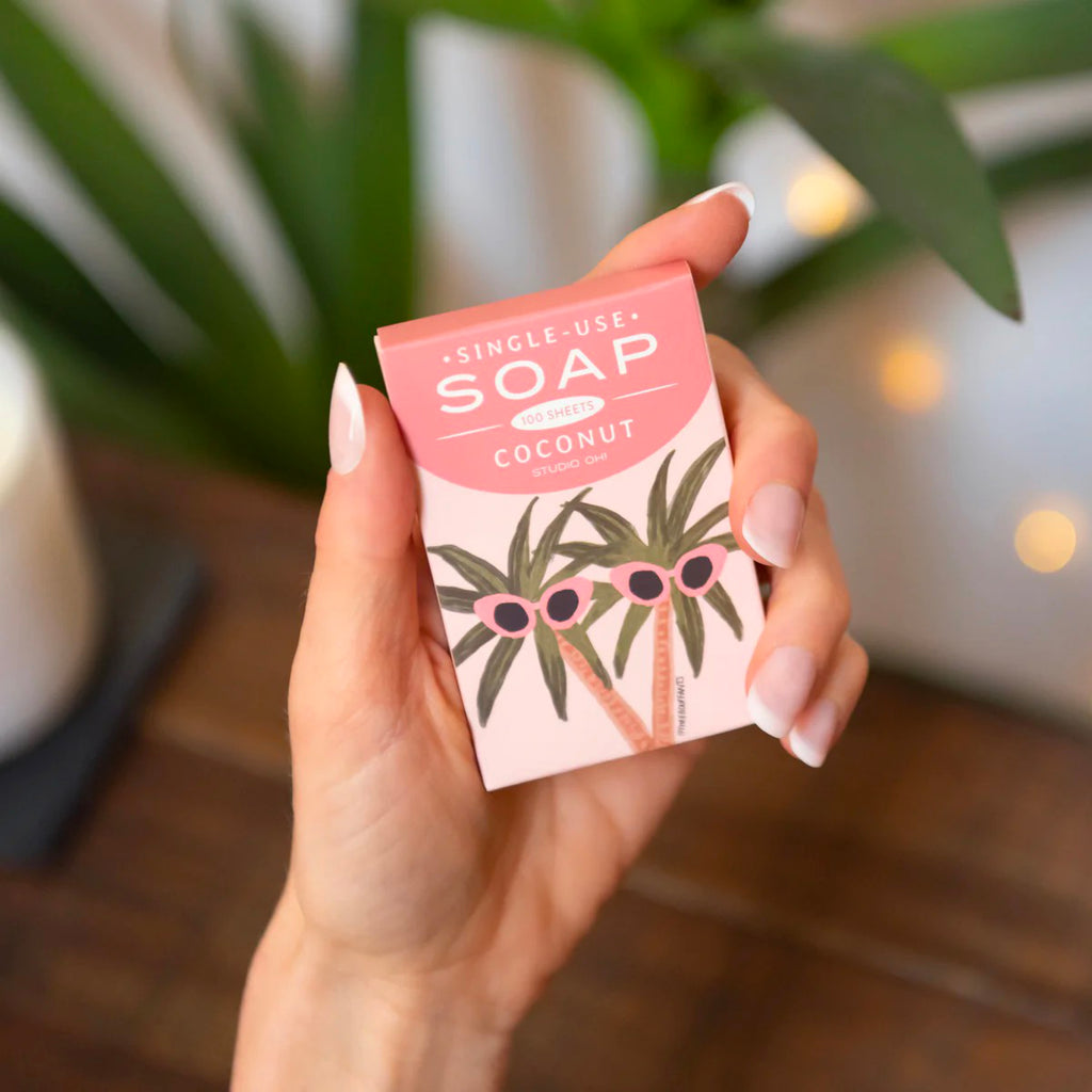 Sunny Palms Single-Use Soap Sheets in hand.