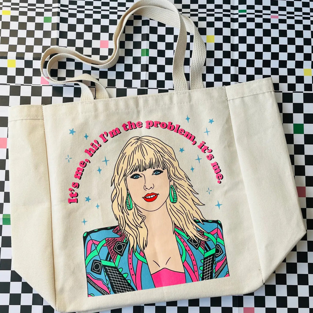 Taylor It's Me, Hi! Tote Bag on table.