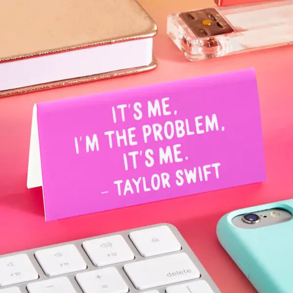 Taylor It's Me, I'm The Problem Desk Sign on table.