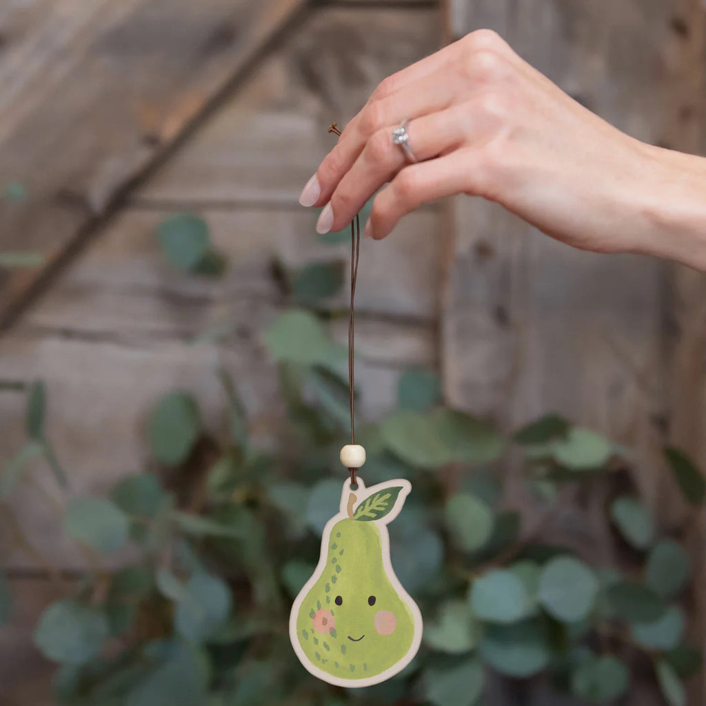 The Happy Pear Car Air Freshener being held.