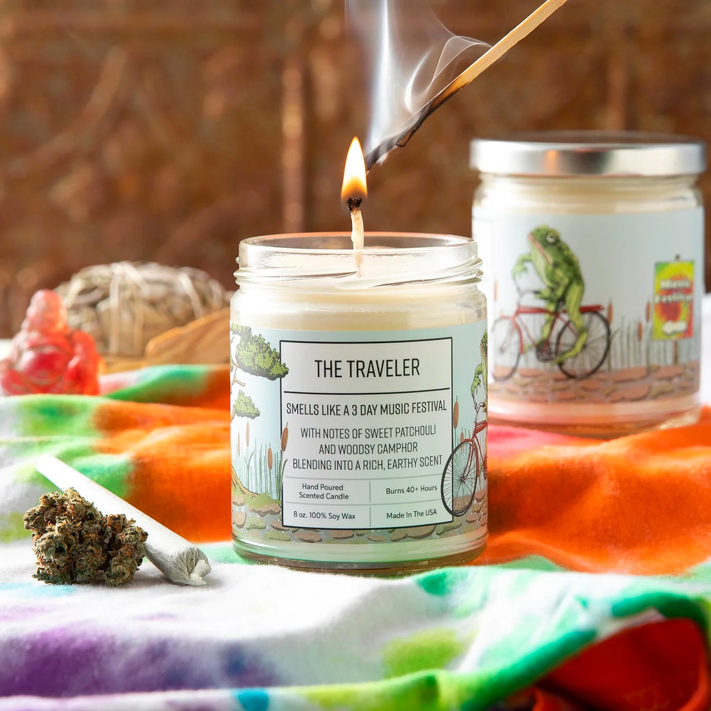 The Traveler 8oz Soy Candle lit.