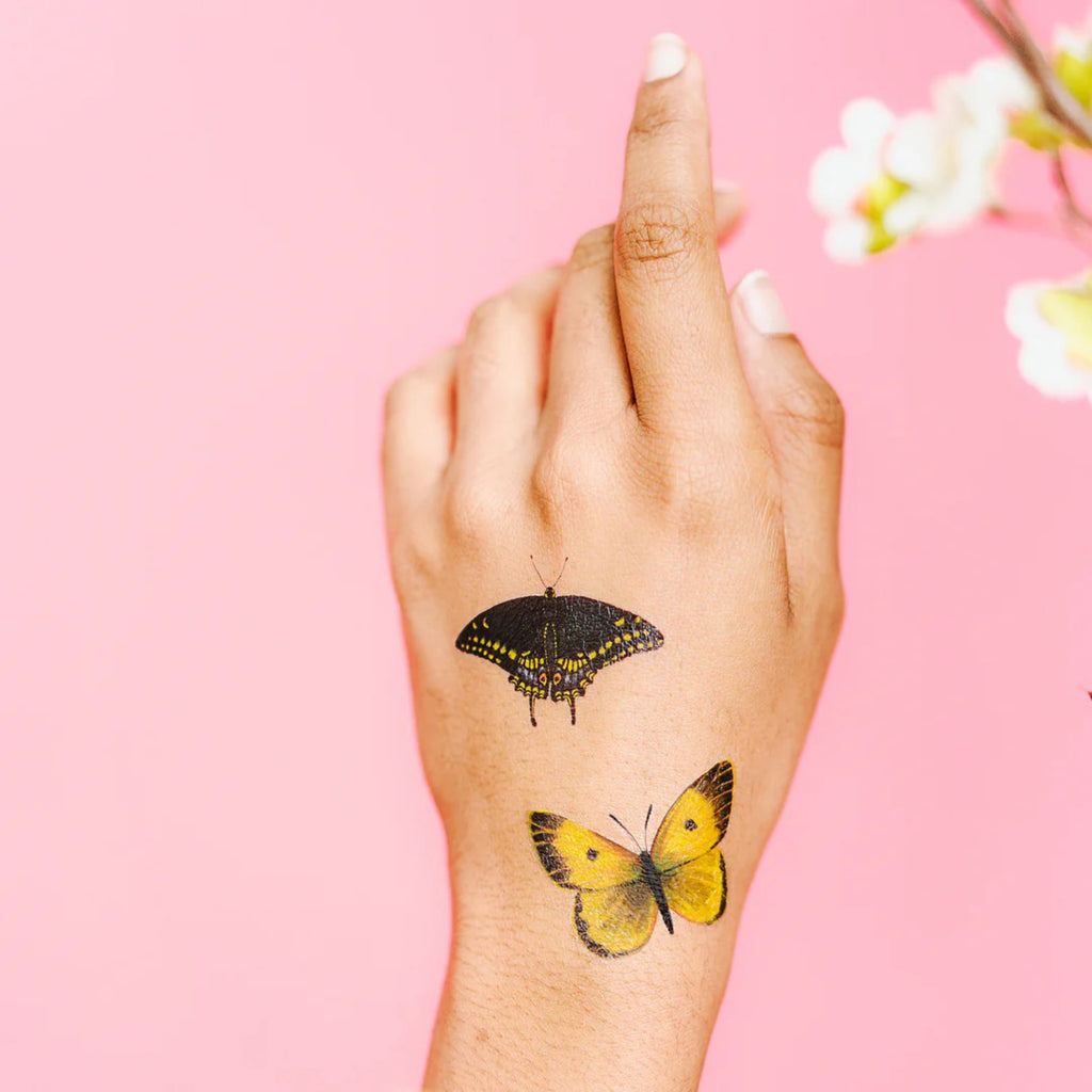 Tiny Butterflies on hands.