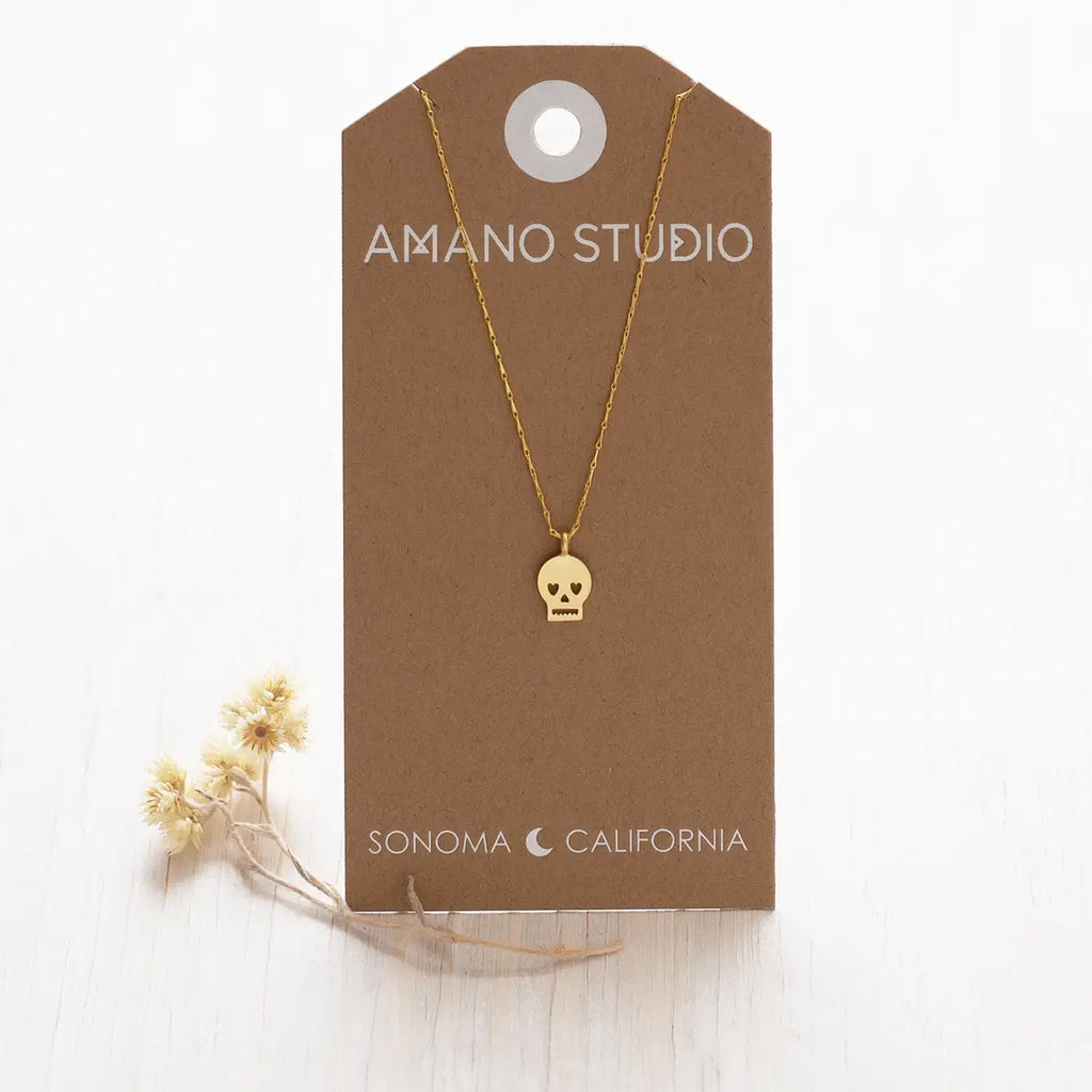 Tiny Skull Necklace on backing card.