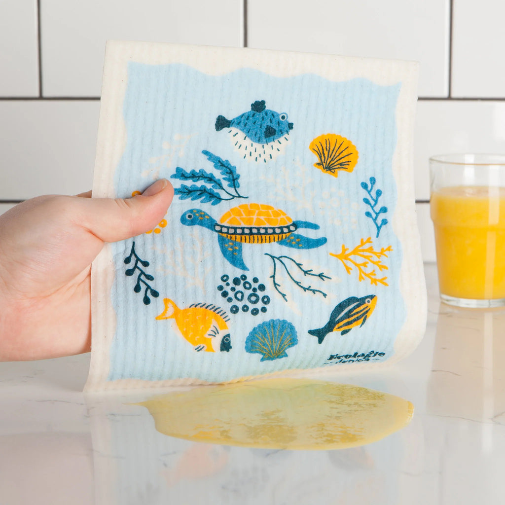Under The Sea Swedish Dishcloth being used to wipe up spill.