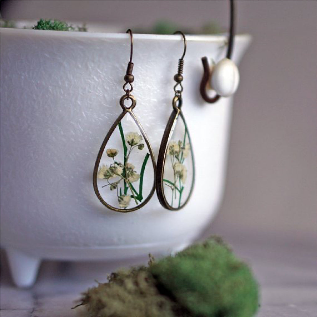 White Flower Pendant Earrings close up.