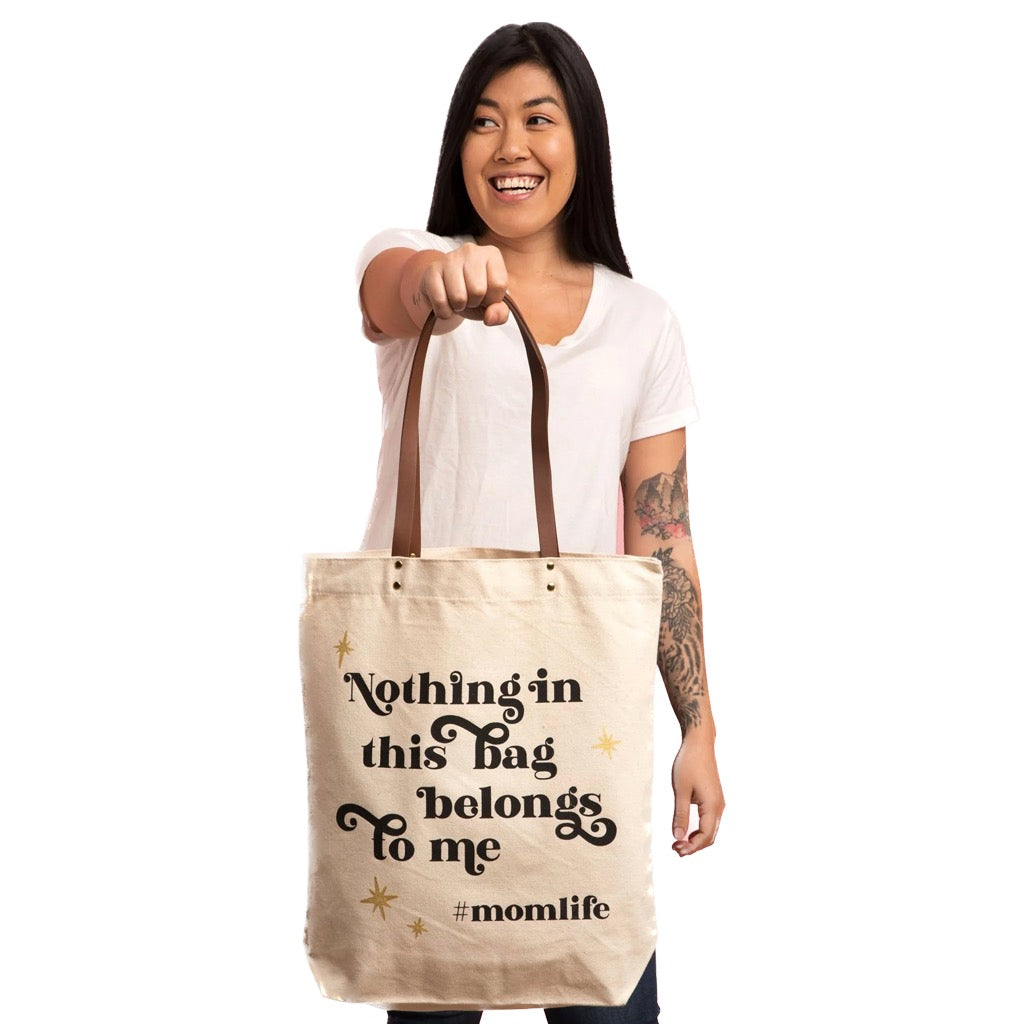 Woman holding Hashtag Mom Life Tote Bag.