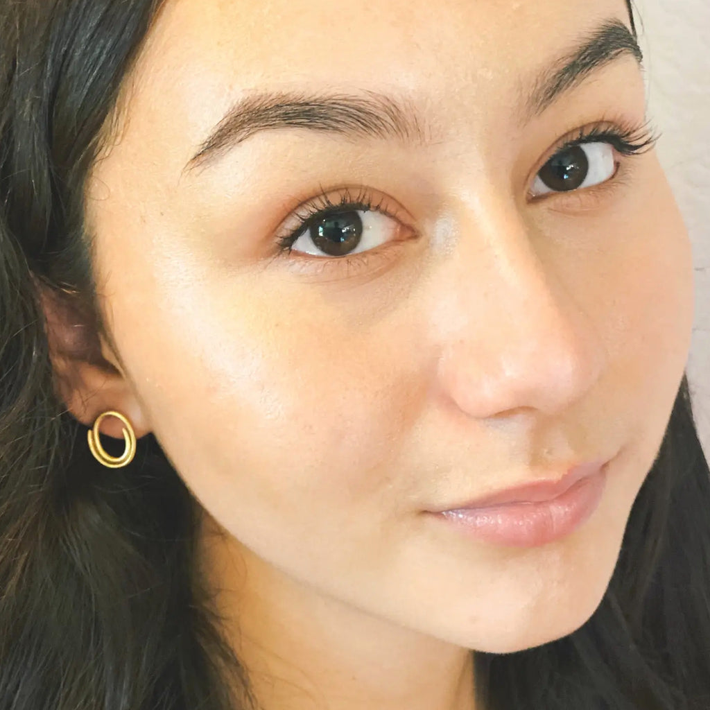 Woman wearing Eris Studs.