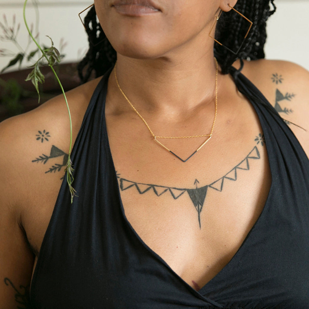 Woman wearing Patina Dipped V Necklace.